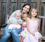 MINOT AIR FORCE BASE, N.D. -- Posing here with her children, Capt. Darci Parker, 5th Medical Operations Squadron women's health nurse practitioner, is one of the newest members of the 5th Medical Group's team of professionals. As a nurse practitioner, she is responsible for health promotion, prevention of reproductive health issues and the diagnosis and treatment of women's health problems, among other things. (Courtesy photo)