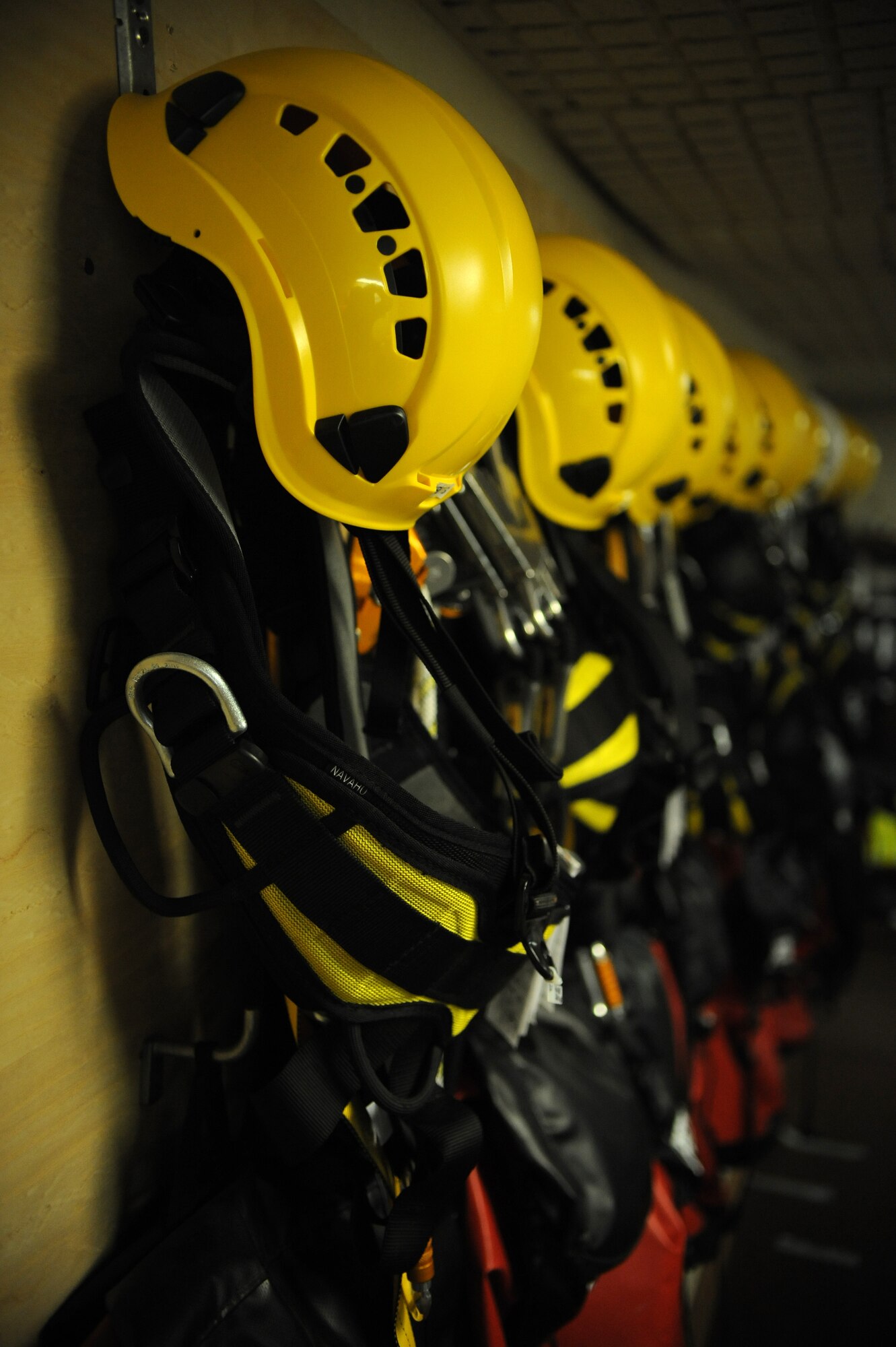 Helmets and safety harnesses line the wall of the 2nd Communications Squadron's Cable Dawgs office on Barksdale Air Force Base, La., Sept. 18. Airmen from 2 CS use harnesses to prevent them from falling when climbing antenna towers. (U.S. Air Force photo/Senior Airman Micaiah Anthony)(RELEASED)