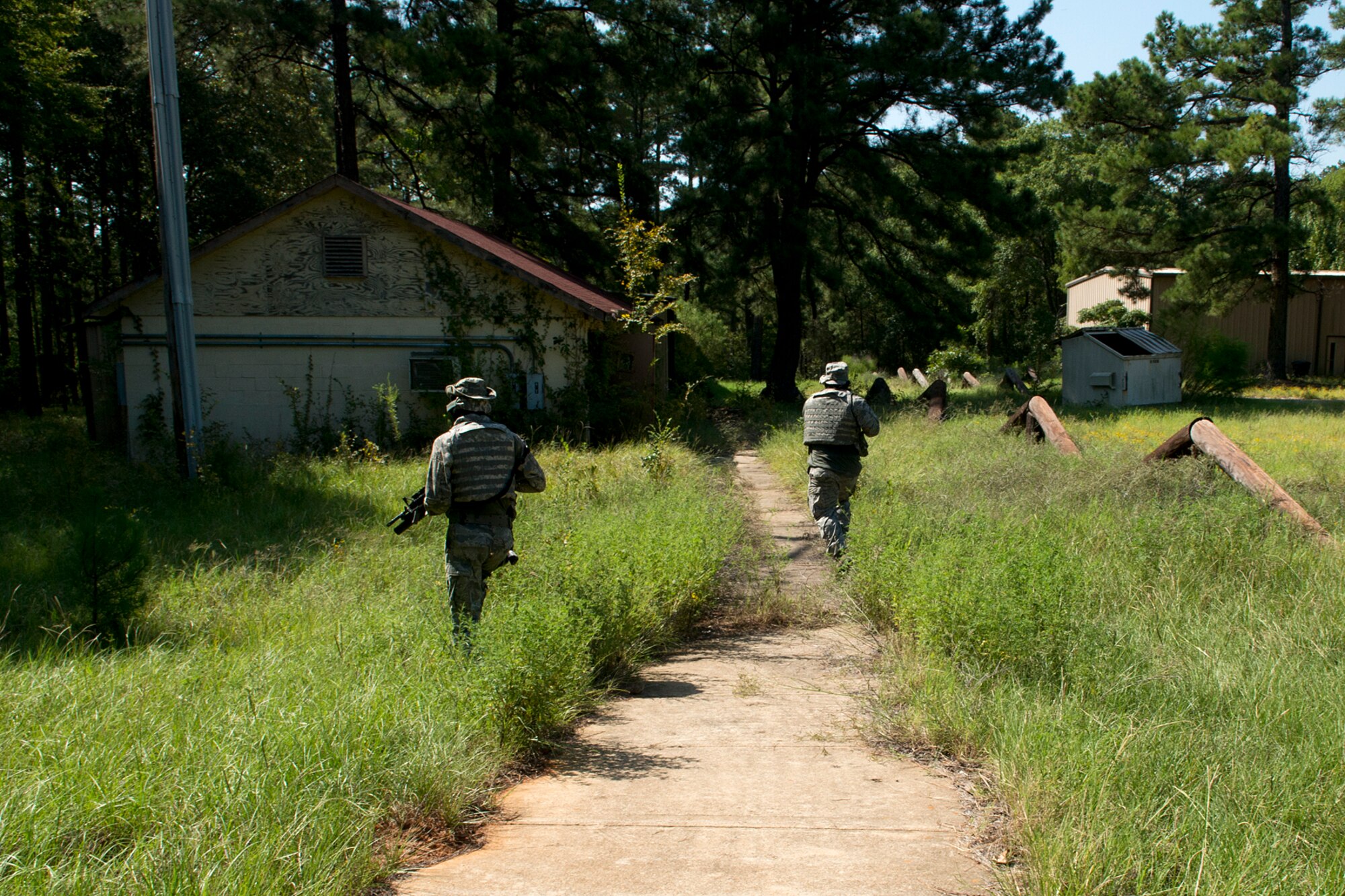 Members of the 307th Security Forces Squadron are on alert as they prepare to search a building during practice for the Global Strike Challenge, Sept. 7, 2012, Barksdale Air Force Base, La. The team practiced clearing buildings and engaging enemy forces at the Warrior Center on the East Reservation at Barksdale. (U.S. Air Force photo by Master Sgt. Greg Steele/Released)