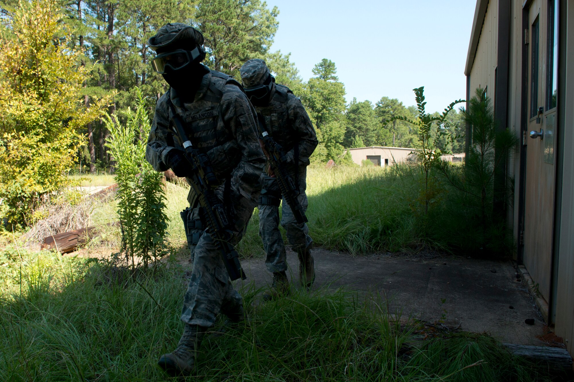 Members of the 307th Security Forces Squadron prepare to clear a building during practice for the Global Strike Challenge, Sept. 7, 2012, Barksdale Air Force Base, La. The competitors will face unknown scenarios during the actual competition that will test their team's response and shooting skills. (U.S. Air Force photo by Master Sgt. Greg Steele/Released)