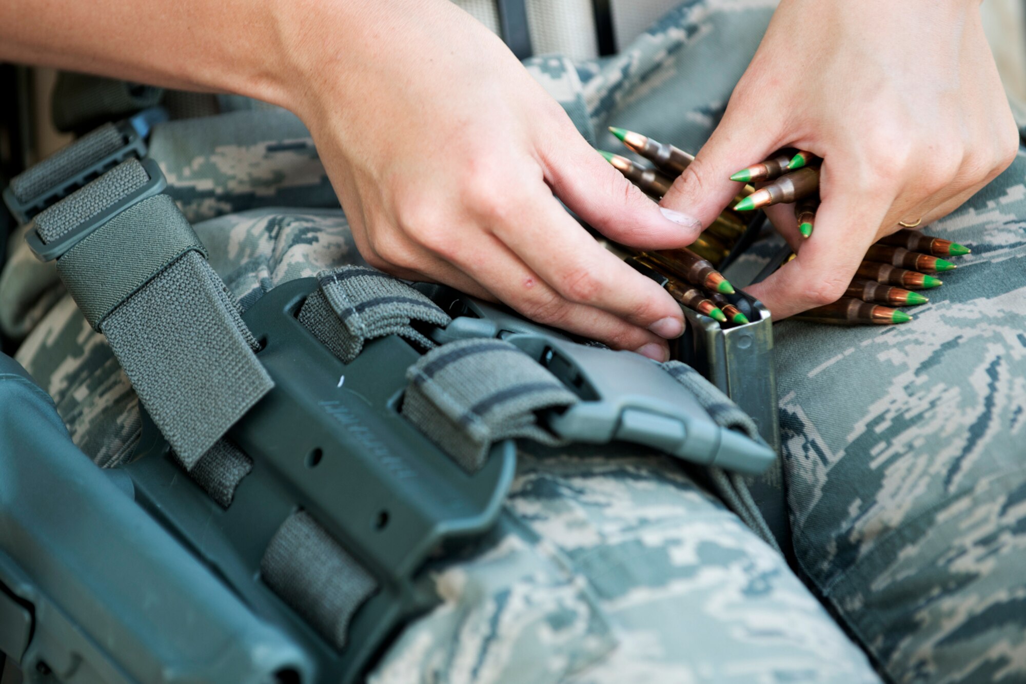U.S. Air Force Airman 1st Class Kellie Morrow, 307th Security Forces Squadron, loads a magazine with 5.56mm rounds in preparation for practicing for the Global Strike Challenge, Sept. 6, 2012, Barksdale Air Force Base, La. Security Forces competitors will be tested on their firearms skills in handling and shooting the Beretta M9 handgun and the M4 assault rifle. (U.S. Air Force photo by Master Sgt. Greg Steele/Released)