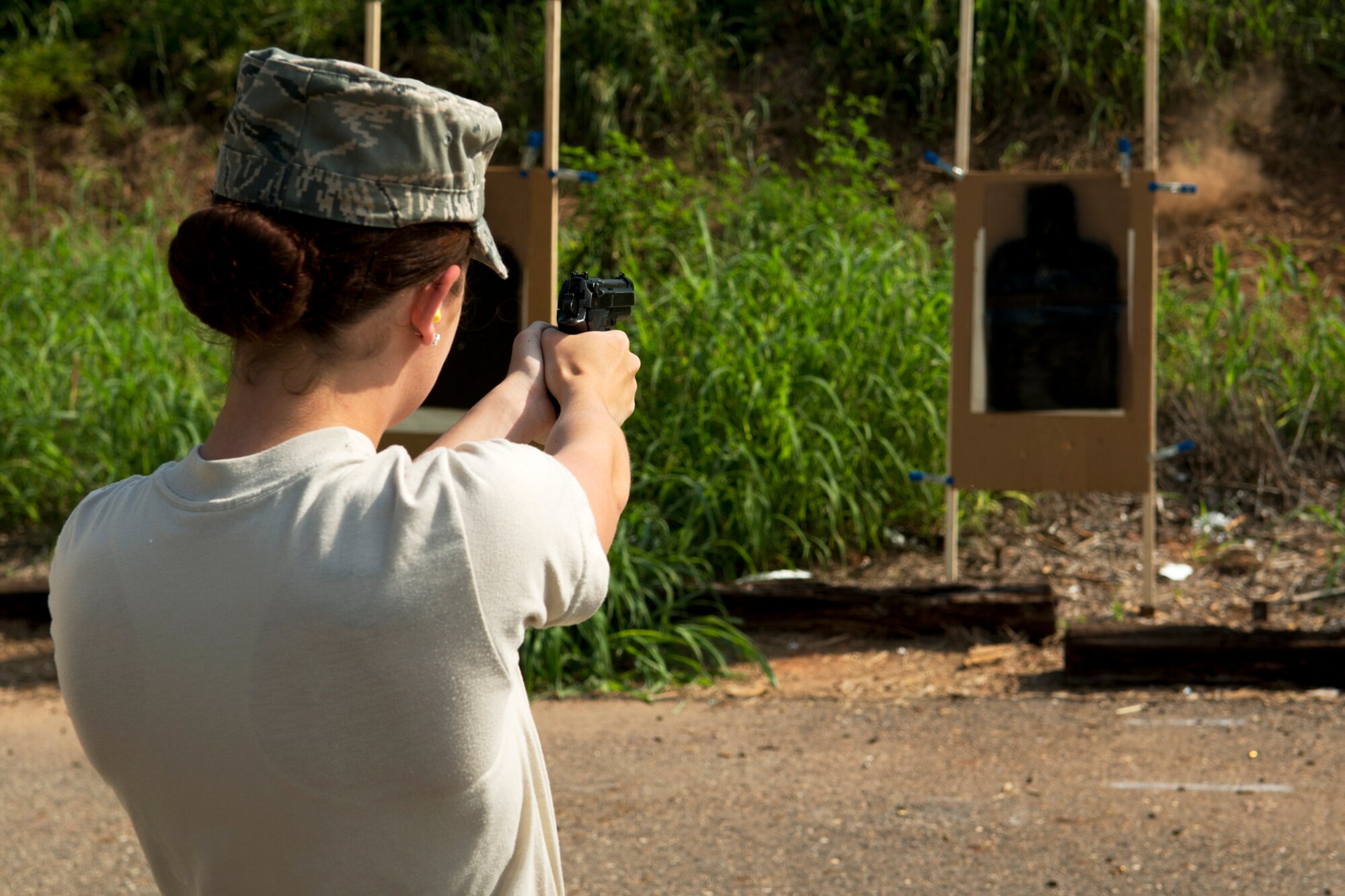 U.S. Air Force Airman 1st Class Kellie Morrow, 307th Security Forces Squadron, practices firing a Beretta M9 in preparation for the Global Strike Challenge, Sept. 6, 2012, Barksdale Air Force Base, La. Security Forces competitors will be tested on their firearms skills in handling and shooting the Beretta M9 handgun and the M4 assault rifle. (U.S. Air Force photo by Master Sgt. Greg Steele/Released)