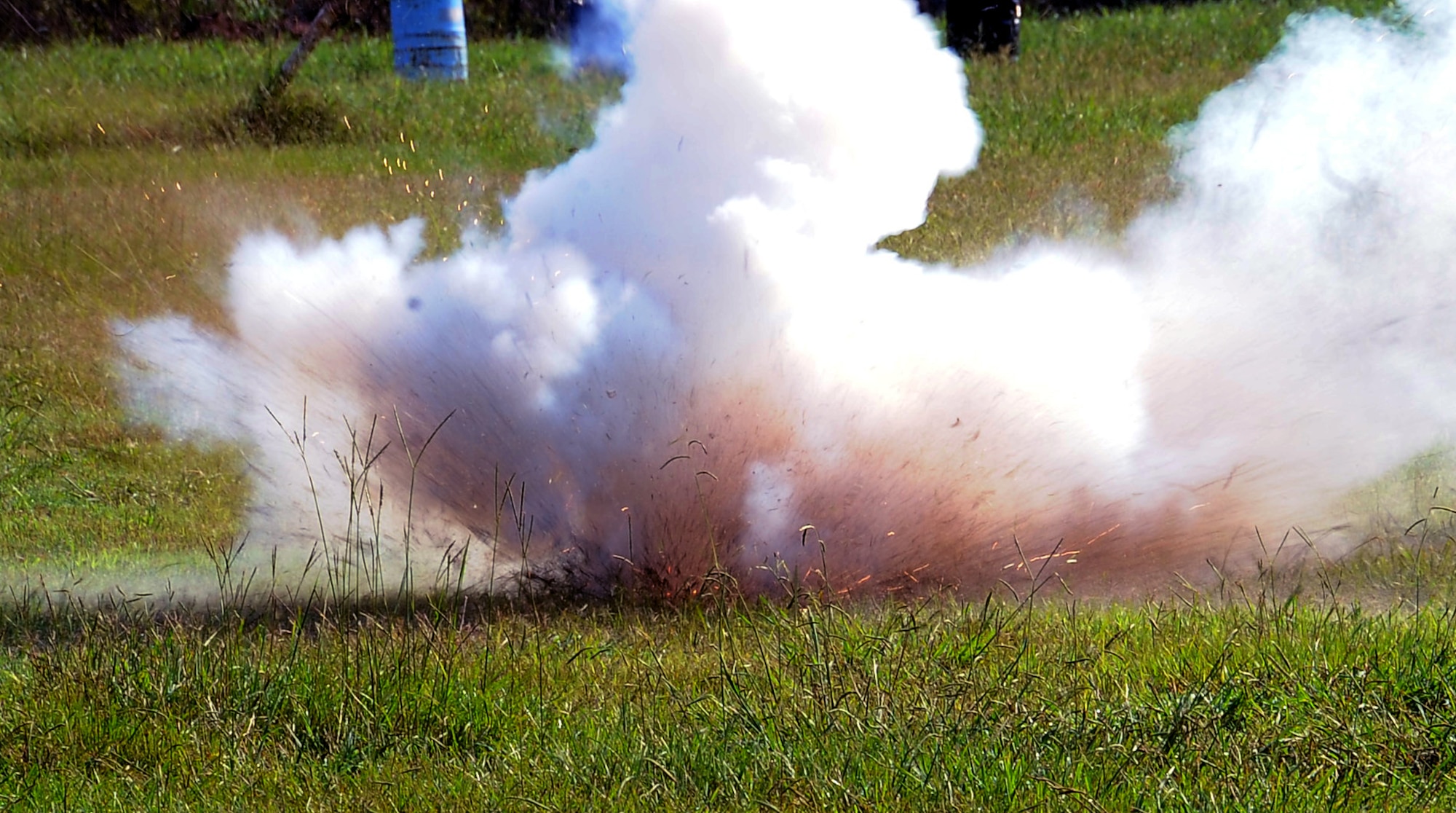 A ground burst simulator explodes at the 2nd Civil Engineer Squadron Explosive Ordnance Disposal facility on Barksdale Air Force Base, La., Sept. 18. EOD technicians taught 11 Barksdale personnel how to safely handle, employ and operate pyrotechnic devices as well as misfire procedures and emergency actions. (U.S. Air Force photo/Staff Sgt. Amber Ashcraft)(RELEASED)