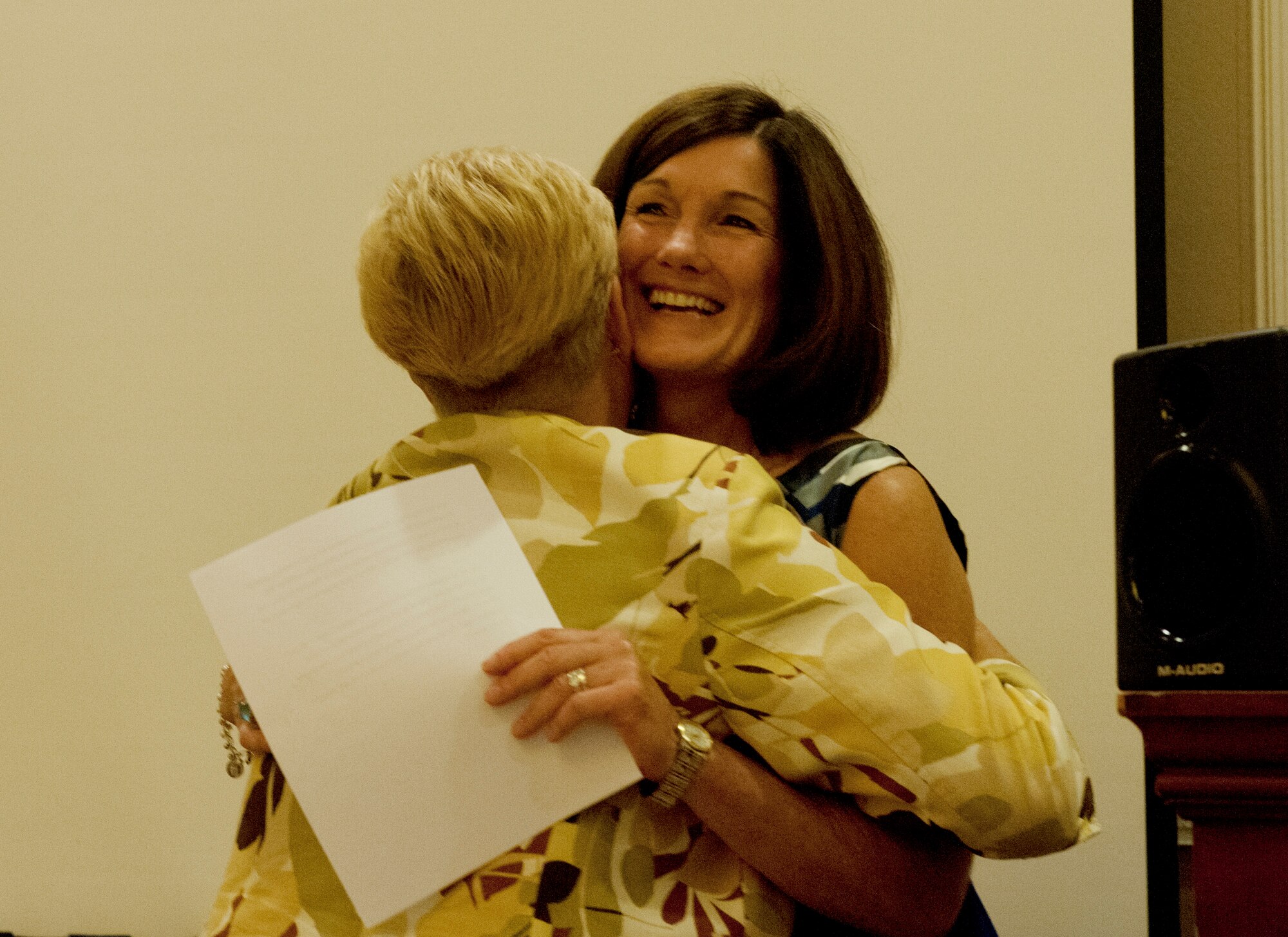 Betty Welsh, right, the wife of Chief of Staff of the Air Force Gen. Mark A. Welsh III, hugs Paula Roy, the wife of Chief Master Sgt. of the Air Force James A. Roy, during the Air Force Association Family Forum in Washington, D.C., Sept. 17, 2012. (U.S. Air Force photo/Val Gempis)
