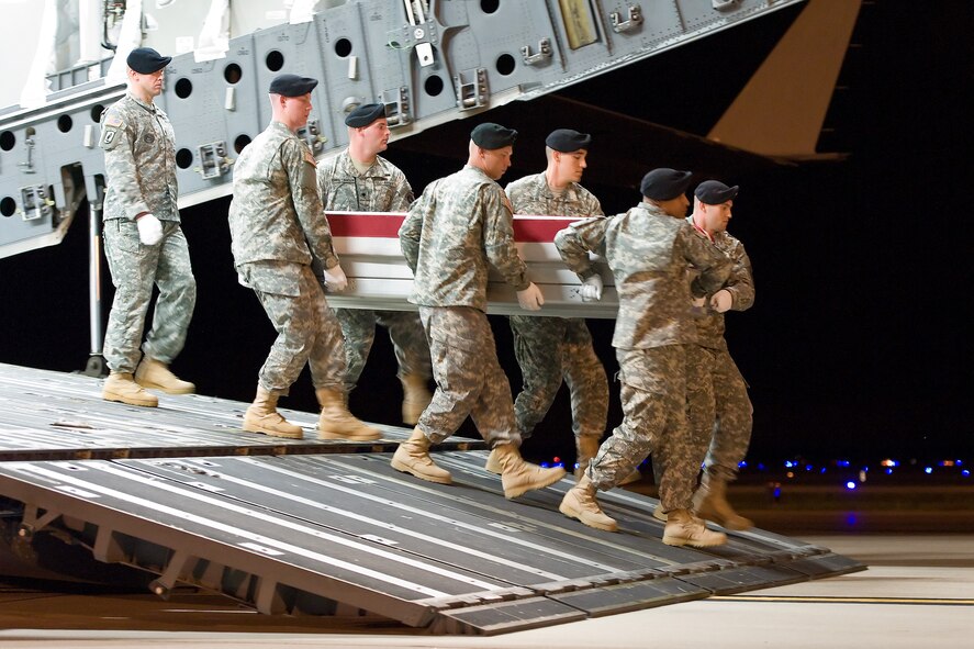 A U.S. Army carry team transfers the remains of Army Pfc. Genaro Bedoy, of Amarillo, Texas, at Dover Air Force Base, Del., Sept. 19, 2012. Bedoy was assigned to 52nd Infantry Regiment, 3rd Stryker Brigade Combat Team, 2nd Infantry Division, Joint Base Lewis-McChord, Wash. (U.S. Air Force photo/Roland Balik)
