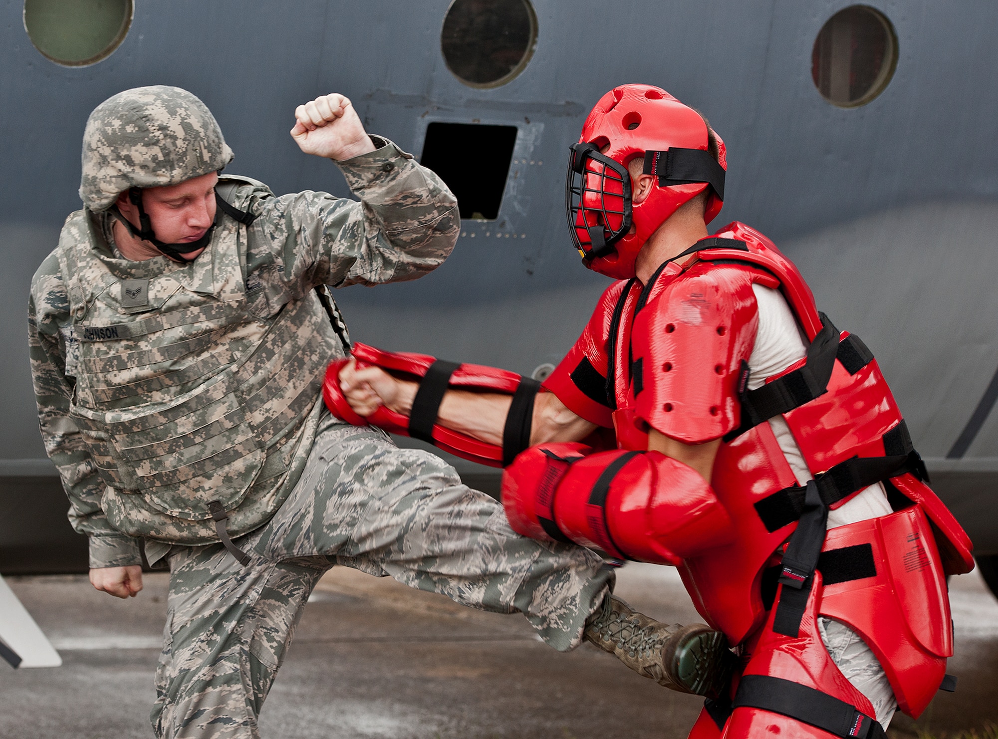 Airman 1st Class Adam Johnson, of the 319th Security Forces Squadron, aims for the weak point of an enemy combatant during a Fly Away Security Team training session Sept. 17 at Eglin Air Force Base, Fla. The course, taught by 96th Ground Combat Training Squadron instructors, brought together security forces Airmen from McConnell AFB, Kansas and Grand Forks AFB, N.D., to learn how to protect aircraft and handle a potential hostile situation.  (US. Air Force photo/Samuel King Jr.)