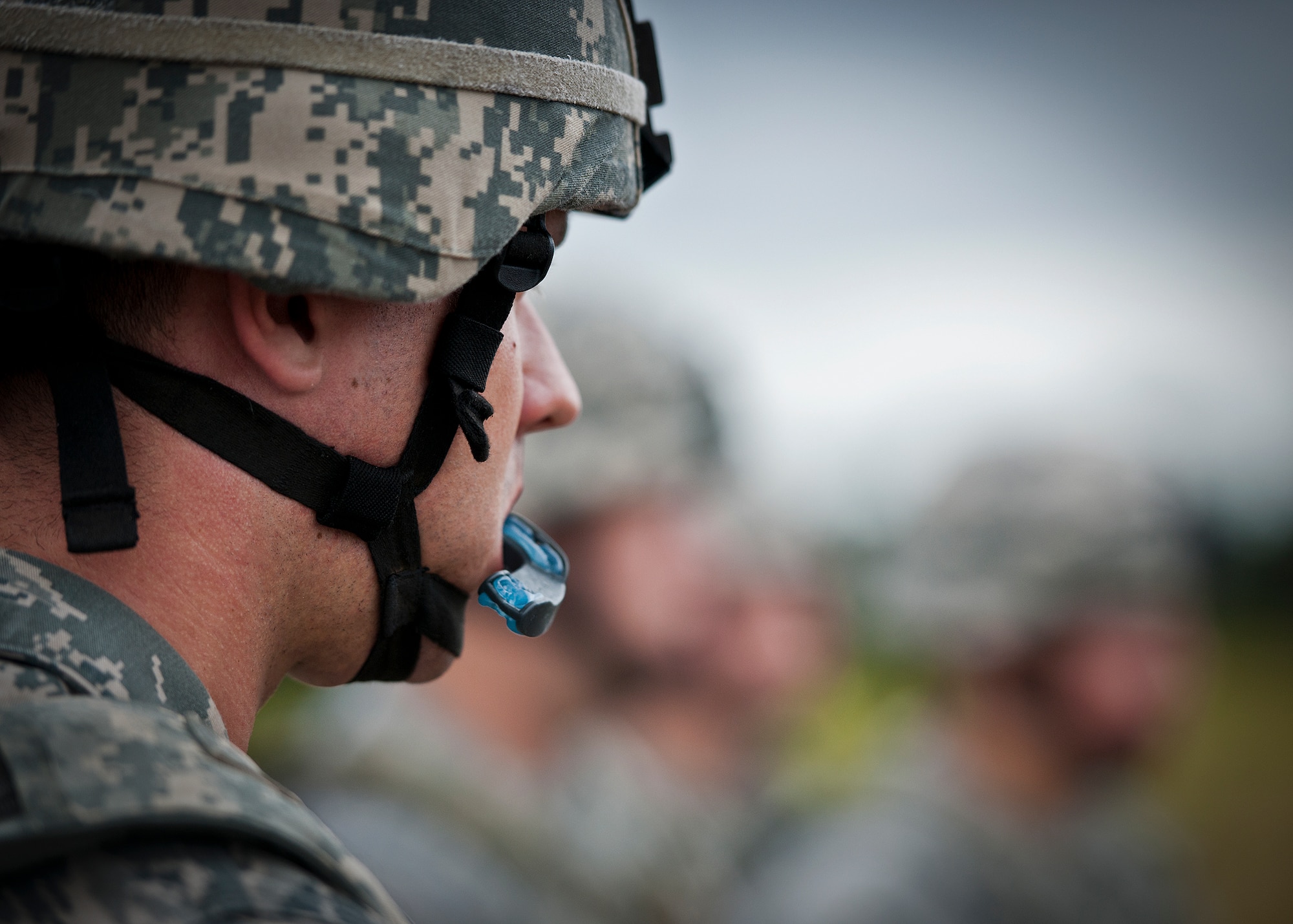 Airman 1st Class Brandon Smith, of the 319th Security Forces Squadron, listens to instructions with other security forces Airmen from Grand Forks Air Force Base, N.D., and McConnell Air Force Base, Kansas, during a Fly Away Security Team training session Sept. 17 at Eglin Air Force Base, Fla. The course, taught by 96th Ground Combat Training Squadron instructors, brought together security forces Airmen from McConnell AFB, Kansas and Grand Forks AFB, N.D., to learn how to protect aircraft and handle a potential hostile situation.  (US. Air Force photo/Samuel King Jr.)
