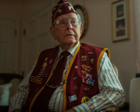 Rut Murray, 87-year-old World War II veteran and ex-Prisoner of War, explains the meaning behind the various patches and buttons on his Ex-American Prisoner of War – Lowcountry Chapter jacket at his home in Saint George, S.C. Murray was awarded the Bronze Star, Purple Heart and Prisoner of War Medals among many others during his military career. Murray spent 97 days as an American POW during World War II. He weighed only 97 pounds when he was liberated toward the end of the war. (U.S. Air Force Photo / Airman 1st Class Tom Brading)
