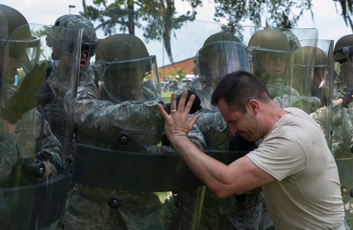 Master Sgt. Chad Hashley, 628th Security Forces Squadron, acts as a bystander during recent Riot Control Training at Joint Base Charleston - Air Base, S.C. The training focused on non-lethal crowd control and use of force procedures employed during various scenarios. (U.S. Air Force photo/ Airman 1st Class Ashlee Galloway)