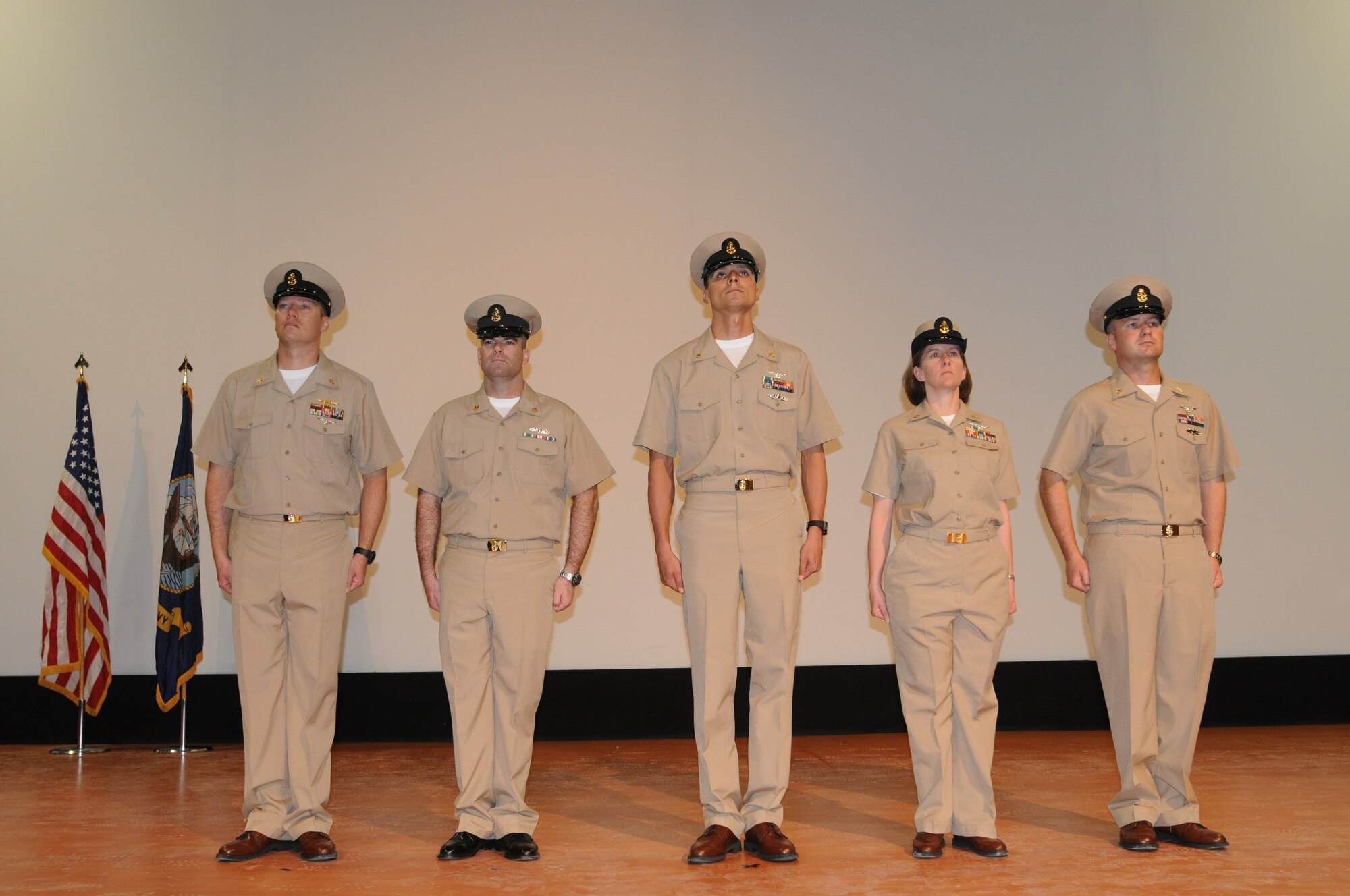 Five newly Chief Petty Officers from Class 119 pose for camera picture during the Chief Petty Officer Pinning Ceremony at the 379th Air Expeditionary Wing in Southwest Asia, September 14, 2012. The Chief Petty Officer?s were pinned here at the 379th Air Expeditionary Wing during the inaugural Chief Petty Officer Pinning Ceremony in Southwest Asia, September 14, 2012. (U.S. Air Force photo/Capt. Craig Carper)