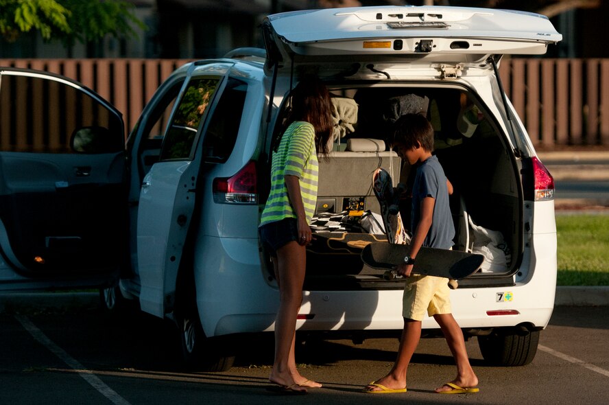 Rie Sohn drops her son Kaui Sohn, 11, off at the Hickam Skate Hangar for skate lessons at Joint Base Pearl Harbor-Hickam, Hawaii. The converted hangar is the only indoor wooden facility on all the Hawaiian Islands. It also boasts the only wooden keyhole bowls, or empty swimming pool shaped ramps, on Oahu. In addition, it has a 15,000 square foot street course, multiple mini ramps, 12-foot vertical ramp with a 14-foot tombstone connected to a saddle and three-quarter pipe. (U.S. Air Force photo/Staff Sgt. Mike Meares)