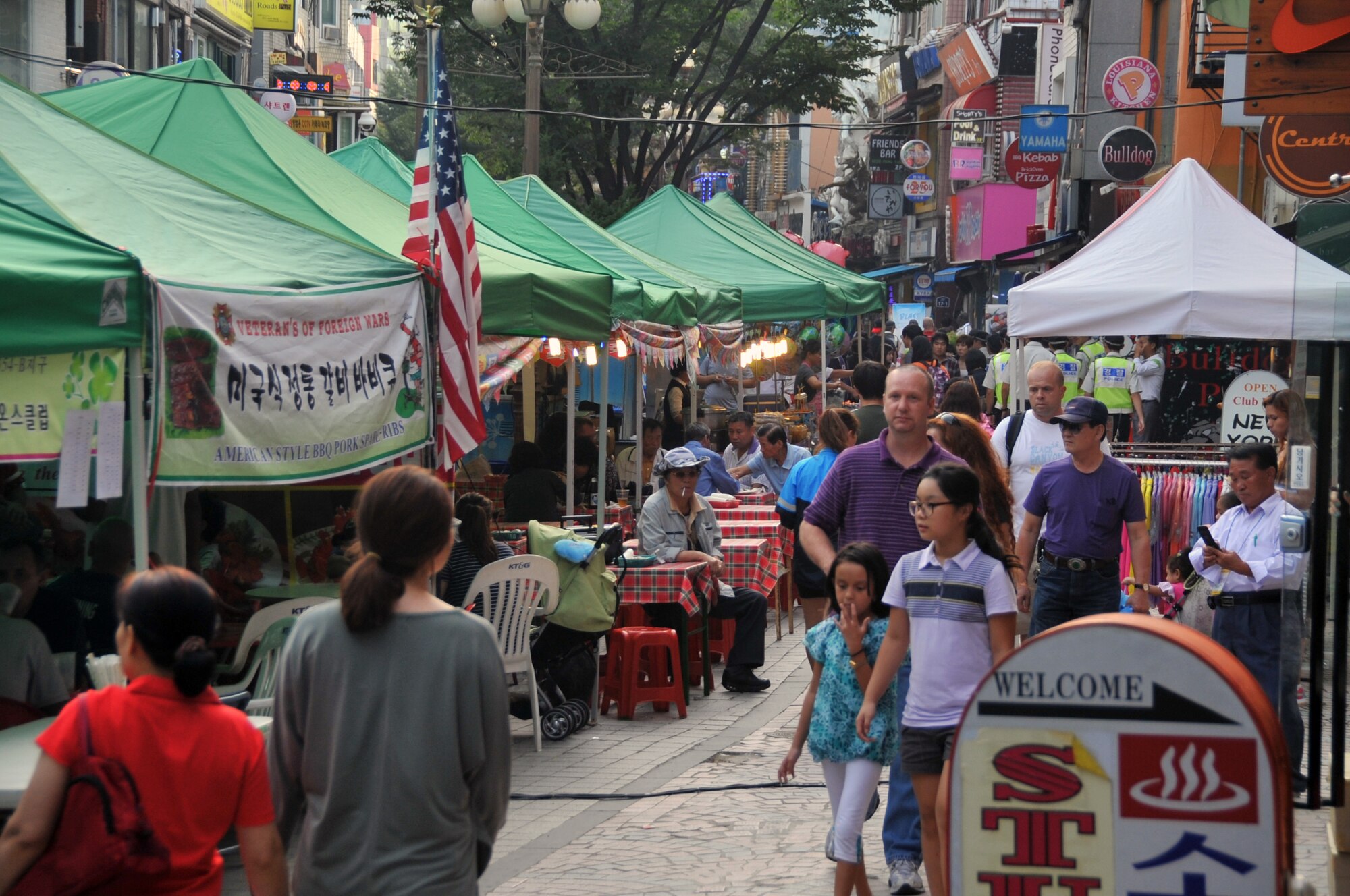 Booths line Shinjang Shopping Mall during the Korean American Friendship Festival Sept. 15-16 outside the gates of Osan Air Base, Republic of Korea. Koreans and Americans came out to enjoy a variety of food, entertainment booths and the chance to buy souvenirs. (U.S. Air Force photo/Staff Sgt. Craig Cisek)