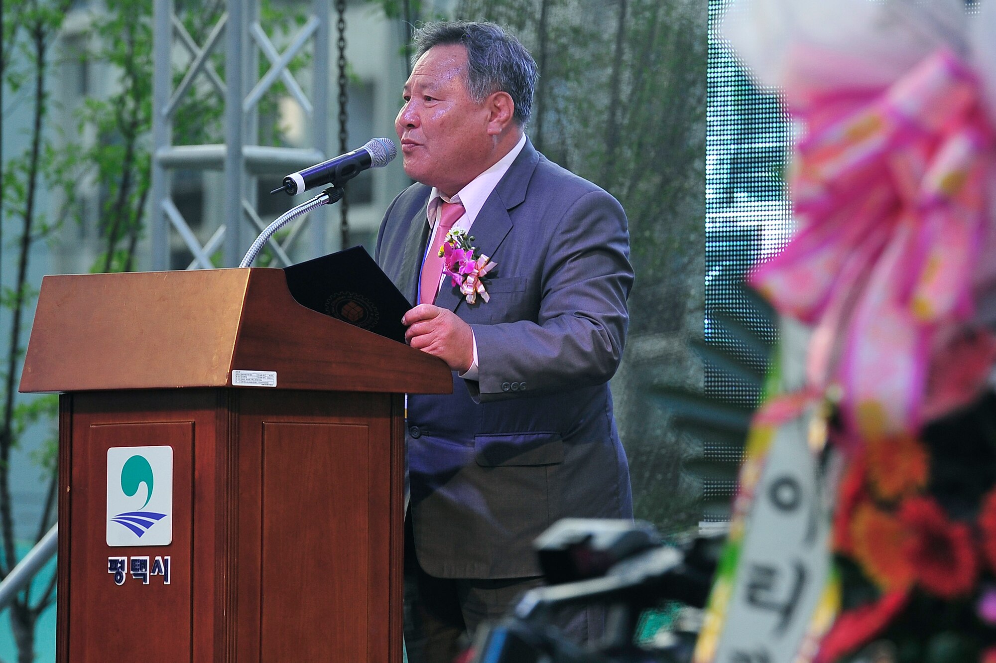 Sun-Ki Kim, Mayor of Pyeongtaek City, Republic of Korea, speaks during the ninth annual Korean American Friendship Festival Sept. 15, 2012. Lt. Gen. Jan-Marc Jouas, 7th Air Force commander, also spoke during a kick-off ceremony at the Songtan International Civic Center just outside one of the gates of Osan Air Base. (U.S. Air Force photo/Tech. Sgt. Raymond Mills)