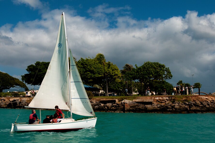The Wet Hens, a sailing group founded by Louis “Papa Lou” Foster, a retired Air Force master sergeant, and creator of Hickam Harbor, sail around the harbor to spread the ashes of their late founder, Sept. 1 at Joint Base Pearl Harbor-Hickam, Hawaii. Founder of the Wets Hens, an all-female sailing club at Hickam, Foster is best known for his sailing skills. He died in his hometown of Eagle Point, Ore., at the age of 90. (U.S Air Force photo/Staff Sgt. Mike Meares)