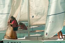 Members of the Wet Hens, a sailing group founded by Louis “Papa Lou” Foster, a retired Air Force master sergeant, and creator of Hickam Harbor, prepare the sails for a ceremonial voyage around Hickam Harbor, Sept. 1 at Joint Base Pearl Harbor-Hickam, Hawaii. Founder of the Wets Hens Foster is best known for his sailing skills. He died in his hometown of Eagle Point, Ore., at the age of 90. (U.S Air Force photo/Staff Sgt. Mike Meares)