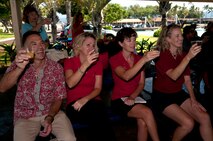 Members of the Wet Hens, a sailing group founded by Louis “Papa Lou” Foster, a retired Air Force master sergeant, and creator of Hickam Harbor, toasts the life and accomplishments of their late founder at Foster Point, Sept. 1 at Joint Base Pearl Harbor-Hickam, Hawaii. Founder of the Wets Hens, an all-female sailing club at Hickam, Foster is best known for his sailing skills. He died in his hometown of Eagle Point, Ore., at the age of 90. (U.S Air Force photo/Staff Sgt. Mike Meares)