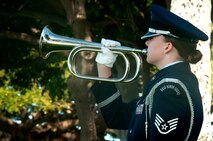 A member of the Hickam Honor Guard performs taps on a bugle during the memorial ceremony for Louis “Papa Lou” Foster, a retired Air Force master sergeant, and creator of Hickam Harbor, at Foster Point, Sept. 1 at Joint Base Pearl Harbor-Hickam, Hawaii. Founder of the Wets Hens, an all-female sailing club at Hickam, Foster is best known for his sailing skills. He died in his hometown of Eagle Point, Ore., at the age of 90. (U.S Air Force photo/Staff Sgt. Mike Meares)