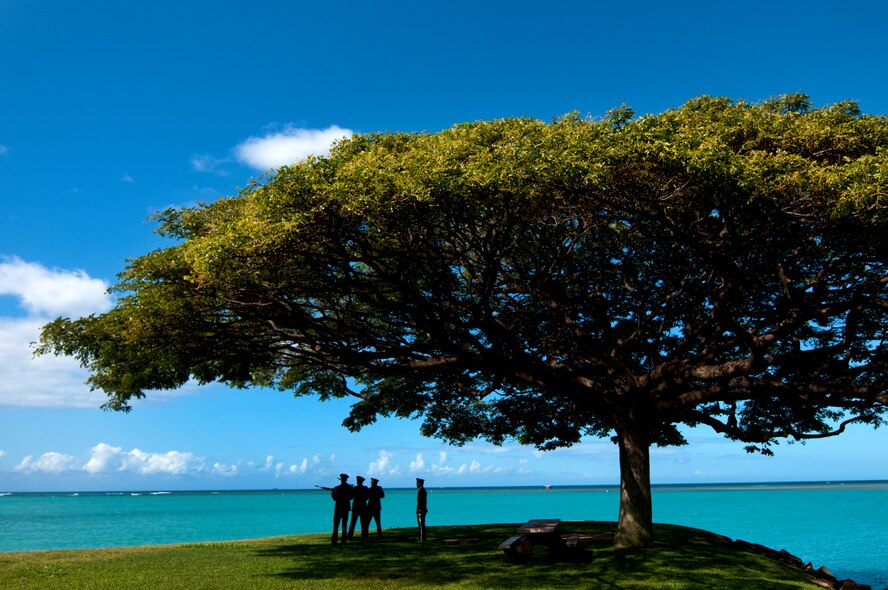 The Hickam Honor Guard fires a three-volley salute during the memorial ceremony for Louis “Papa Lou” Foster, a retired Air Force master sergeant, and creator of Hickam Harbor, at Foster Point, Sept. 1 at Joint Base Pearl Harbor-Hickam, Hawaii. Founder of the Wets Hens, an all-female sailing club at Hickam, Foster is best known for his sailing skills. He died in his hometown of Eagle Point, Ore., at the age of 90. (U.S Air Force photo/Staff Sgt. Mike Meares)