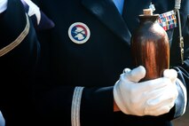 The remains of Louis “Papa Lou” Foster, a retired Air Force master sergeant, and creator of Hickam Harbor, are deliver to the family by the Hickam Honor Guard during a memorial ceremony at Foster Point, Sept. 1 at Joint Base Pearl Harbor-Hickam, Hawaii. Founder of the Wets Hens, an all-female sailing club at Hickam, Foster is best known for his sailing skills. He died in his hometown of Eagle Point, Ore., at the age of 90. (U.S Air Force photo/Staff Sgt. Mike Meares)