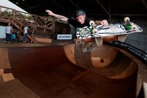 U.S. Army Sgt. Chris Gray, 82nd Engineer Support Company, Schofield Barracks, Hawaii, catches some air while skating at the Hickam Skate Hangar, Aug. 23, at Joint Base Pearl Harbor-Hickam, Hawaii. The converted hangar is the only indoor wooden facility on all the Hawaiian Islands. It also boasts the only wooden keyhole bowls, or empty swimming pool shaped ramps, on Oahu. In addition, it has a 15,000 square foot street course, multiple mini ramps, 12-foot vertical ramp with a 14-foot tombstone connected to a saddle and three-quarter pipe. (U.S. Air Force photo/Staff Sgt. Mike Meares)
