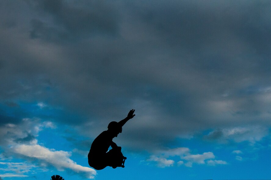 U.S. Army Sgt. Chris Gray, 82nd Engineer Support Company, Schofield Barracks, Hawaii, catches some air while skating at the Hickam Skate Hangar, Aug. 23, at Joint Base Pearl Harbor-Hickam, Hawaii. As an Air Force brat in the 1990s, he grew up skating in the early days of the park when his family was stationed at Hickam. Once stationed in Hawaii, he checked in at his unit, then went to the skate hangar. (U.S. Air Force photo/Staff Sgt. Mike Meares)