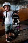 Lindsey Hawk, 5, shows how tough she is while learning to skate on a skateboard Aug. 22 at Joint Base Pearl Harbor Hickam, Hawaii. The converted hangar is the only indoor wooden facility on all the Hawaiian Islands. It also boasts the only wooden keyhole bowls, or empty swimming pool shaped ramps, on Oahu. In addition, it has a 15,000 square foot street course, multiple mini ramps, 12-foot vertical ramp with a 14-foot tombstone connected to a saddle and three-quarter pipe. (U.S. Air Force photo/Staff Sgt. Mike Meares)