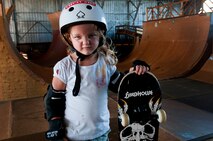 Lindsey Hawk, 5, shows how tough she is while learning to skate on a skateboard Aug. 22 at Joint Base Pearl Harbor Hickam, Hawaii. The converted hangar is the only indoor wooden facility on all the Hawaiian Islands. It also boasts the only wooden keyhole bowls, or empty swimming pool shaped ramps, on Oahu. In addition, it has a 15,000 square foot street course, multiple mini ramps, 12-foot vertical ramp with a 14-foot tombstone connected to a saddle and three-quarter pipe. (U.S. Air Force photo/Staff Sgt. Mike Meares)