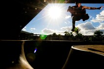 Chris Kays, son of the Hickam Skate Hangar’s proprietor Mike Kays, performs a trick at the Hickam Skate Hangar Aug. 21, Joint Base Pearl Harbor-Hickam, Hawaii. He is a professionally sponsored skateboarder who provides lessons for any level of skater at the hangar. The converted hangar is the only indoor wooden facility on all the Hawaiian Islands. It also boasts the only wooden keyhole bowls, or empty swimming pool shaped ramps, on Oahu. In addition, it has a 15,000 square foot street course, multiple mini ramps, 12-foot vertical ramp with a 14-foot tombstone connected to a saddle and three-quarter pipe. (U.S. Air Force photo/Staff Sgt. Mike Meares)