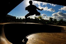 Chris Kays, son of the Hickam Skate Hangar’s proprietor Mike Kays, performs a trick at the Hickam Skate Hangar Aug. 21, Joint Base Pearl Harbor-Hickam, Hawaii. He is a professionally sponsored skateboarder who provides lessons for any level of skater at the hangar. The converted hangar is the only indoor wooden facility on all the Hawaiian Islands. It also boasts the only wooden keyhole bowls, or empty swimming pool shaped ramps, on Oahu. In addition, it has a 15,000 square foot street course, multiple mini ramps, 12-foot vertical ramp with a 14-foot tombstone connected to a saddle and three-quarter pipe. (U.S. Air Force photo/Staff Sgt. Mike Meares)