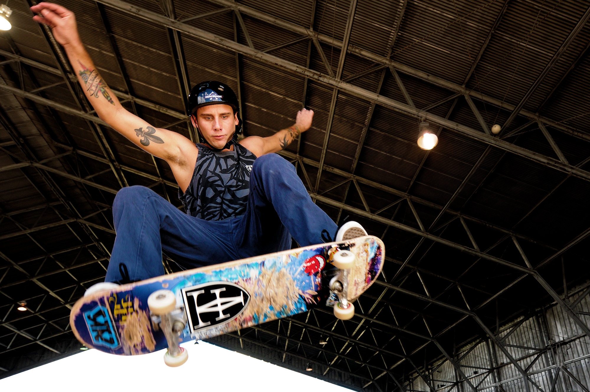 Chris Kays, son of the Hickam Skate Hangar’s proprietor Mike Kays, performs a trick at the Hickam Skate Hangar Aug. 21, Joint Base Pearl Harbor-Hickam, Hawaii. He is a professionally sponsored skateboarder who provides lessons for any level of skater at the hangar. The converted hangar is the only indoor wooden facility on all the Hawaiian Islands. It also boasts the only wooden keyhole bowls, or empty swimming pool shaped ramps, on Oahu. In addition, it has a 15,000 square foot street course, multiple mini ramps, 12-foot vertical ramp with a 14-foot tombstone connected to a saddle and three-quarter pipe. (U.S. Air Force photo/Staff Sgt. Mike Meares)
