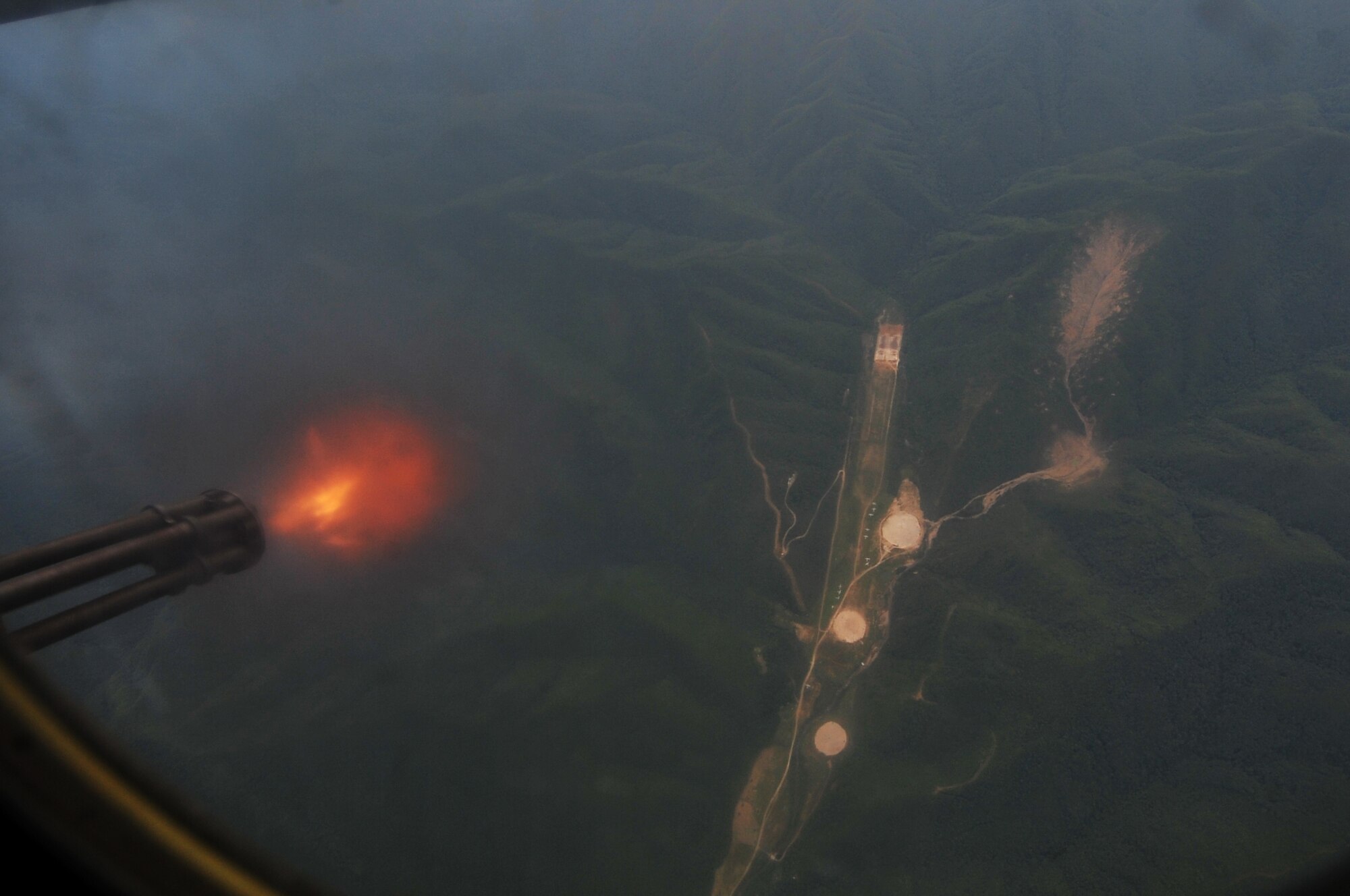 A 25mm Gatling-type rotary cannon fires down on Pilsung Range from an AC-130U Spooky gunship during exercise Teak Knife 12-3 over the Republic of Korea, Sept. 12, 2012. Teak Knife 12-3 highlights the longstanding military partnership between the U.S. and ROK by enhancing the combat readiness of U.S. and Republic of Korea Special Operations and supporting forces through combined and joint live-fire training. (U.S. Air Force photo/Staff Sgt. Craig Cisek)