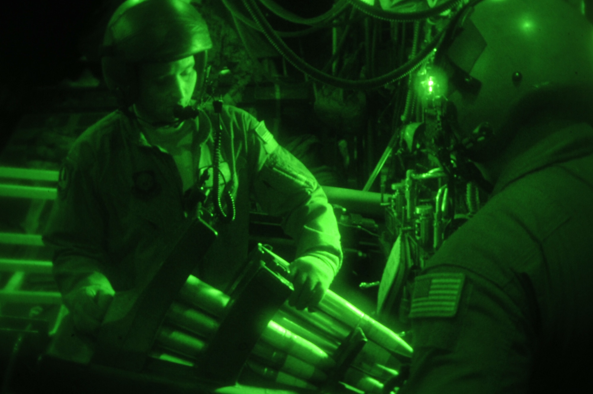 Aerial gunner Tech. Sgt. James, reloads 40mm rounds into an auto-cannon aboard an AC-130U Spooky gunship during exercise Teak Knife 12-3 at Osan Air Base, Republic of Korea, Sept. 12, 2012. Teak Knife is part of regularly scheduled training designed to enhance the readiness of U.S. and ROK forces to defend the Republic of Korea and sustain the capabilities which strengthen the U.S. - ROK Alliance. (U.S. Air Force photo/Staff Sgt. Craig Cisek)