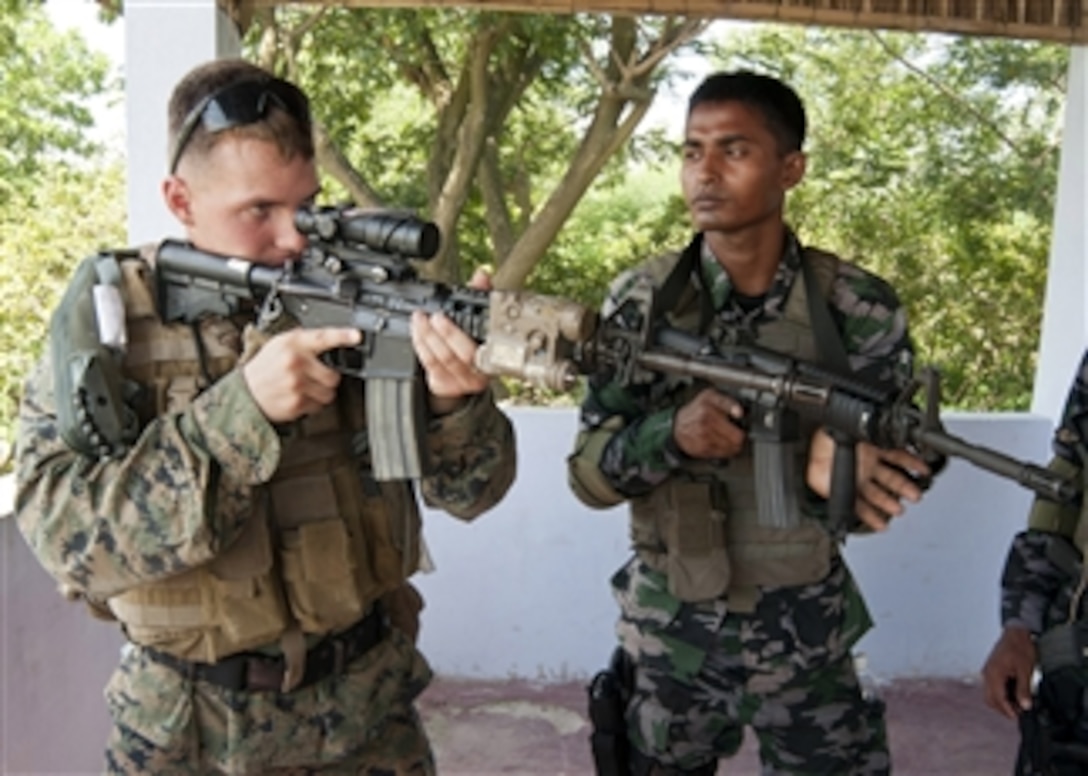 U.S. Marine Lance Cpl. Zachary Hodge, left, trains with sailors from the Bangladesh Special Warfare Diving and Salvage unit during Cooperation Afloat Readiness and Training 2012 in Chittagong, Bangladesh, on Sept. 19, 2012.  The readiness training is a series of bilateral military exercises between the U.S. Navy and the armed forces of Bangladesh, Brunei, Cambodia, Indonesia, Malaysia, the Philippines, Singapore, Thailand and Timor-Leste.  Hodge is assigned to the Fleet Anti-terrorism Security Team Pacific.