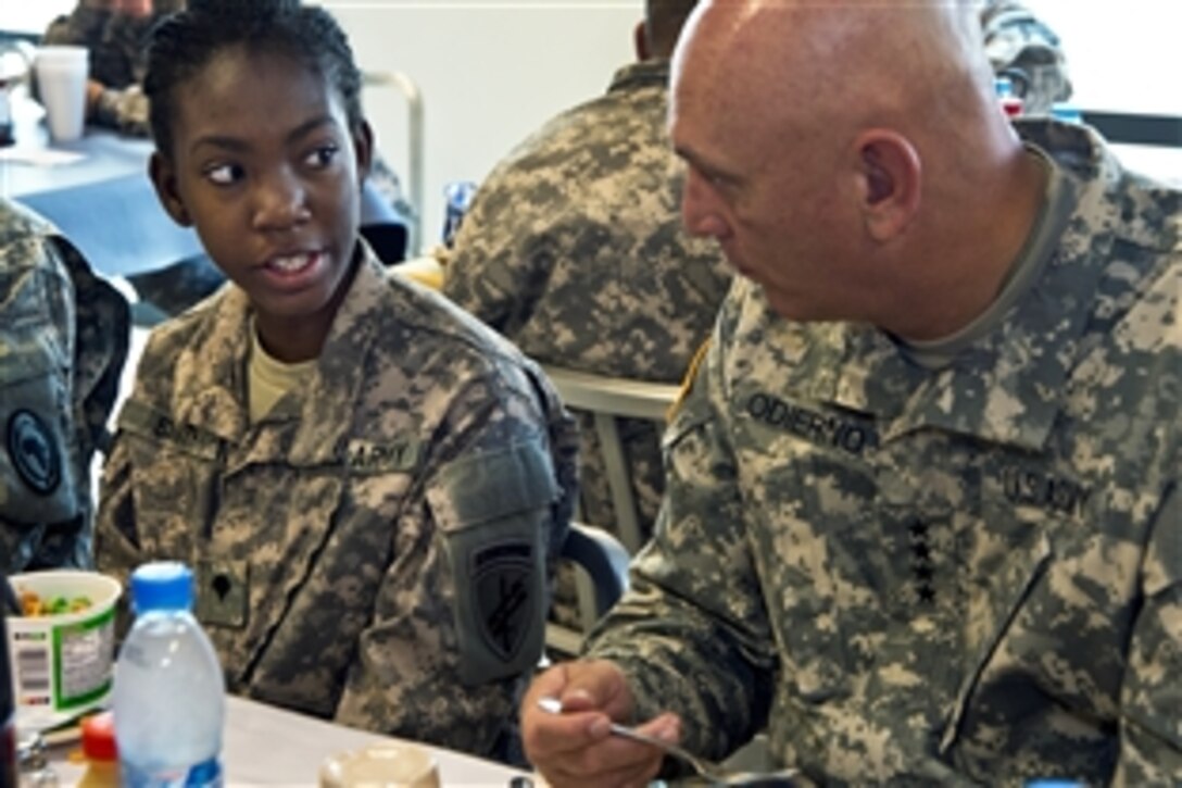 U.S. Army Spc. Jeraldine Smith speaks with U.S. Army Chief of Staff Gen. Ray Odierno during breakfast on Camp Lemonnier in Djibouti, Sept. 19, 2012. Smith, an administrator assigned to Company A, 448th Civil Affairs Battalion, shared her background and Army highlights with Odierno. 