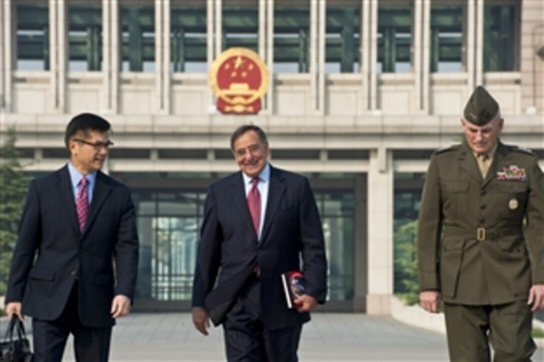 U.S. Defense Secretary Leon E. Panetta, center, walks with U.S. Ambassador to China Gary Locke, left, and U.S. Marine Corps Lt. Gen. John F. Kelly before departing Beijing, Sept. 20, 2012.