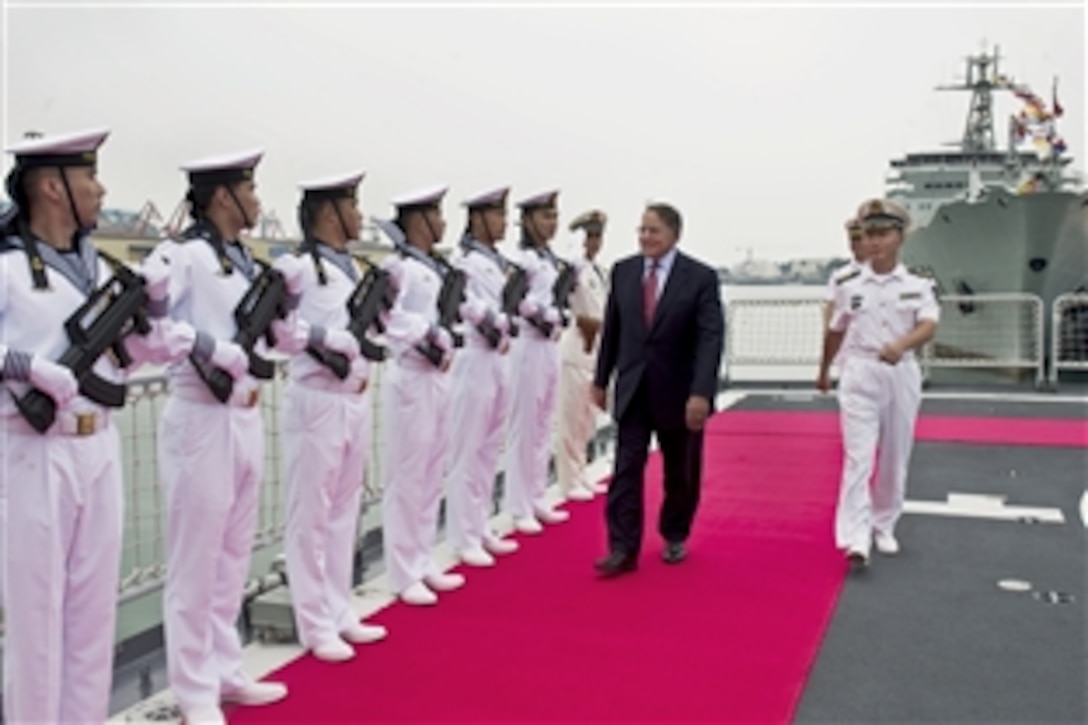 U.S. Defense Secretary Leon E. Panetta receives an escort through an honor cordon after boarding a Chinese frigate in Qingdao, China, Sept. 20, 2012. Panetta visited Tokyo before Beijing and Qingdao, and will continue to Auckland, New Zealand, during a weeklong trip to the Asia-Pacific region.