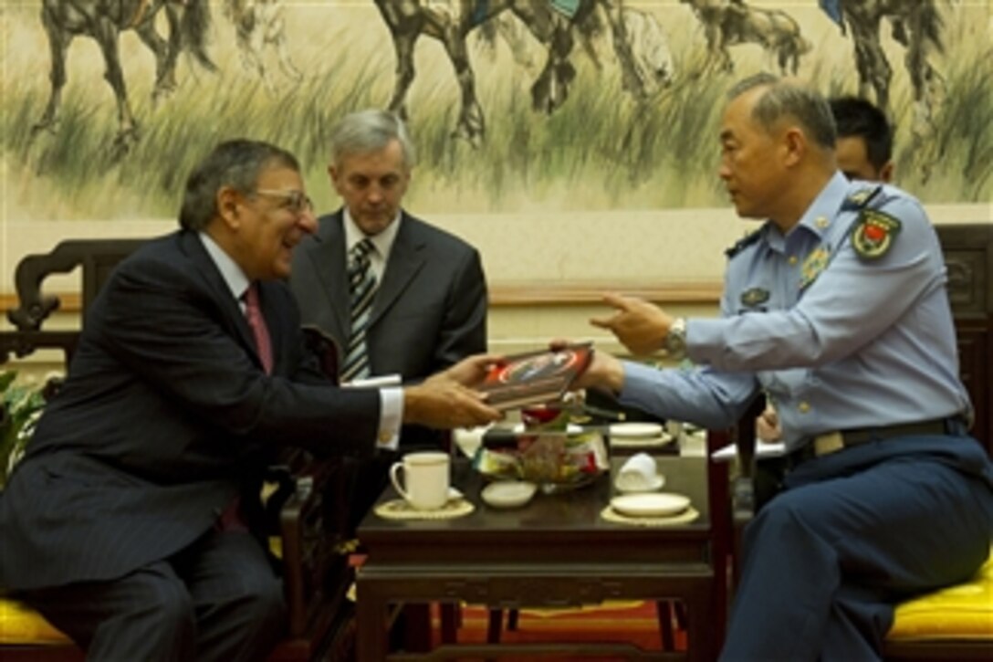 Deputy Chief of General Staff of the Chinese Army Gen. Ma Xiaotian, right, presents Secretary of Defense Leon E. Panetta with a book during their departure meeting in Beijing, China, on Sept. 20, 2012.  Panetta visited with his defense counterparts and Chinese Vice President Xi Jinping in Beijing to discuss regional security issues of interest to both nations.  Panetta will travel to Auckland, New Zealand, the last stop on his weeklong trip to the Pacific.  