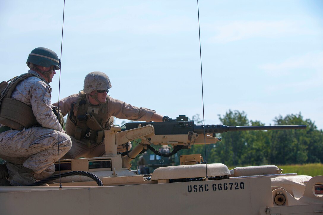 Staff Sgt. Jonathan M. Griffith, ordnance maintenance chief assigned to Combat Logistics Battalion (CLB) 26, 26th Marine Expeditionary Unit (MEU), loads the .50-caliber machine gun on a M88A2 heavy equipment recovery combat utility lift and evacuation system at Fort Pickett, Va., Sept. 15, 2012. The weapon system on the HERCULES allows Marines to remotely aim and fire the weapon from inside the safety of the cabin by utilizing a mounted camera on the weapon system. This training is part of the 26th MEU's pre-deployment training program. CLB-26 is one of the three reinforcements of 26th MEU, which is slated to deploy in 2013.