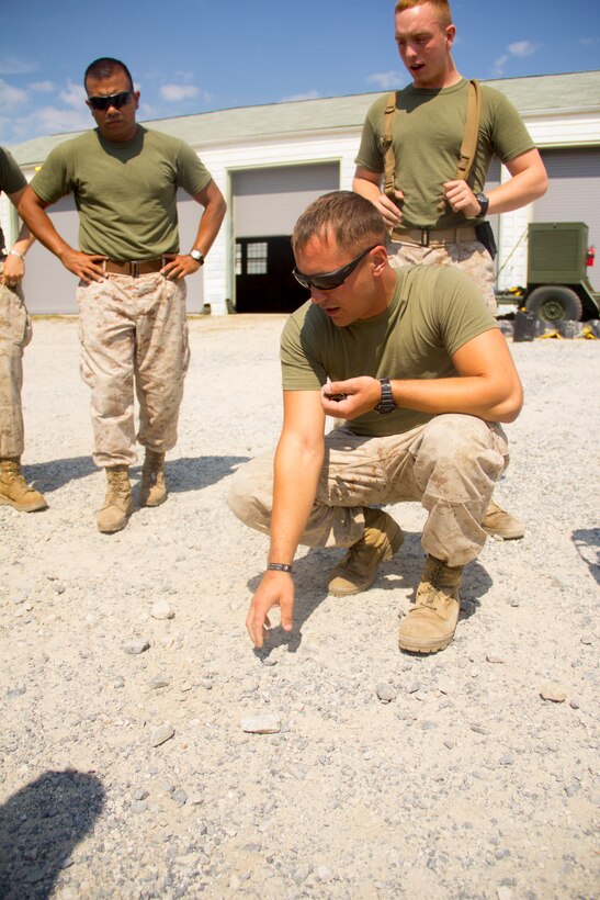 Cpl. David Lamb, engineer from Cleveland, Ohio, with Combat Logistics Battalion (CLB) 26 instructs other Marines in the basics of minesweeping, part of a training plan to teach Marines the basics of other occupational specialties at Fort Pickett, Va., Sept. 15, 2012. This training is part of the 26th Marine Expeditionary Unit's pre-deployment training program. CLB-26 is one of the three reinforcements of 26th MEU, which is slated to deploy in 2013.