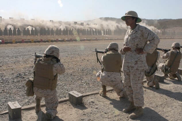 Cpl. India Harris, a range coach with Headquarters and Headquarters Squadron and a Crescent City, Fla., native, watches Marines conduct the table two portion of the M16-A4 service rifle qualification on Carlos Hathcock Range Complex aboard Marine Corps Air Station Miramar, Calif., Sept 20. Marines must qualify annually on an M-16A4 rifle.