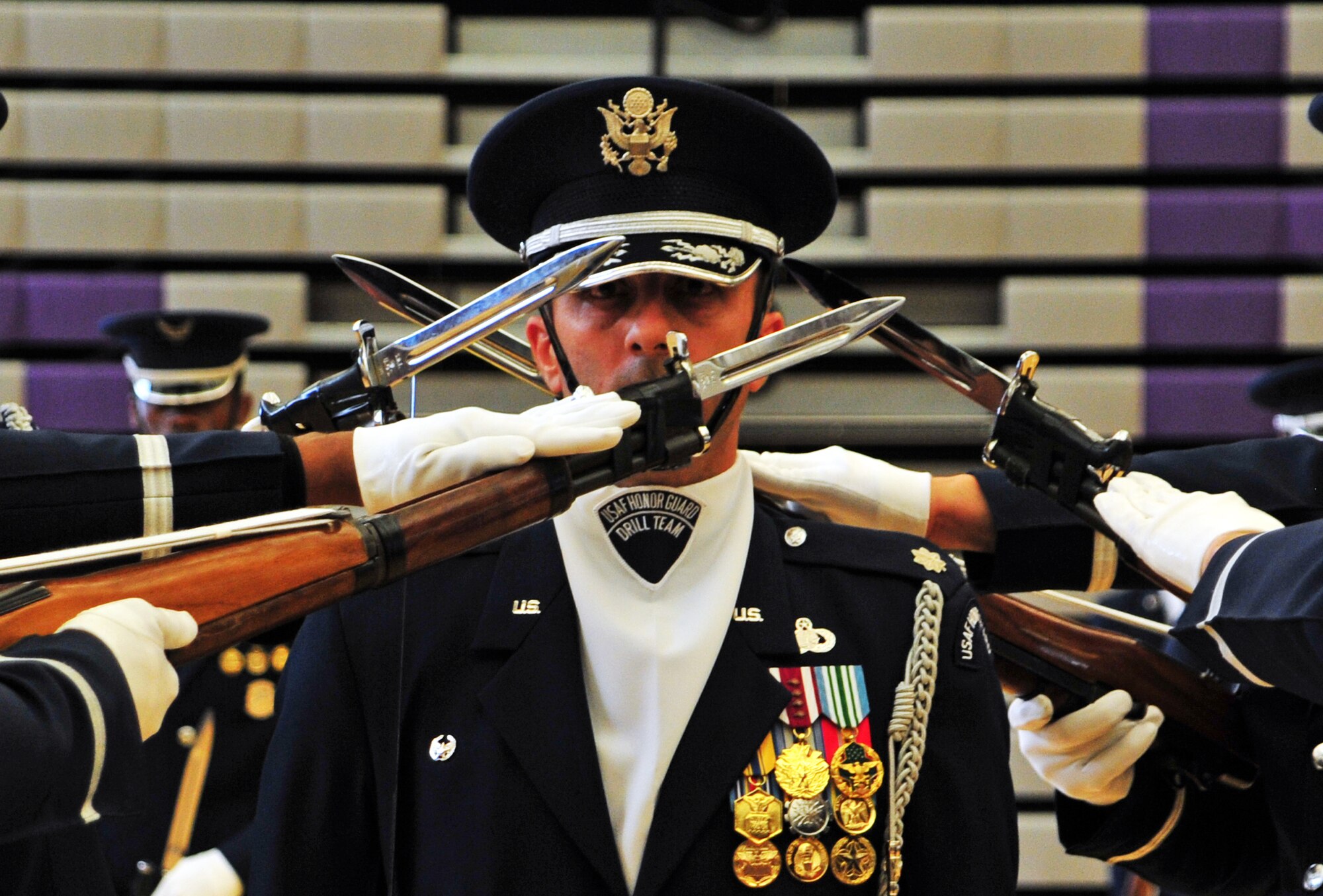 Lt. Col. Kenneth Marentette, U.S. Air Force Honor Guard commander, leads a 4-man rifle drill team during a performance at Rogers High School, Spokane, Wash., Sept. 19, 2012. The primary mission of the U.S. Air Force Honor Guard is to represent Airmen to the American public and the world. (U.S. Air Force photo by Airman 1st Class Taylor Curry)