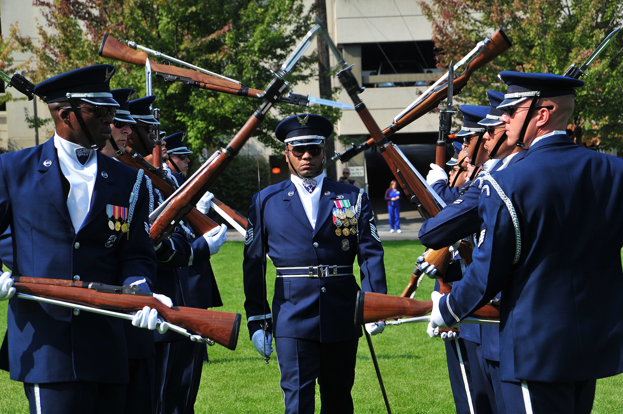 Master Sgt. Whitfield Jack, U.S. Air Force Honor Guard NCO in-charge, marches through the rifle gauntlet, considered to be a very dangerous maneuver, during a performance at the Lewis and Clark High School, Spokane, Wash., Sept. 19, 2012. The vision of the USAF Honor Guard is to ensure a legacy of Airmen who, promote the mission, protect the standards, perfect the image and preserve the heritage. (U.S. Air Force photo by Airman 1st Class Taylor Curry)
