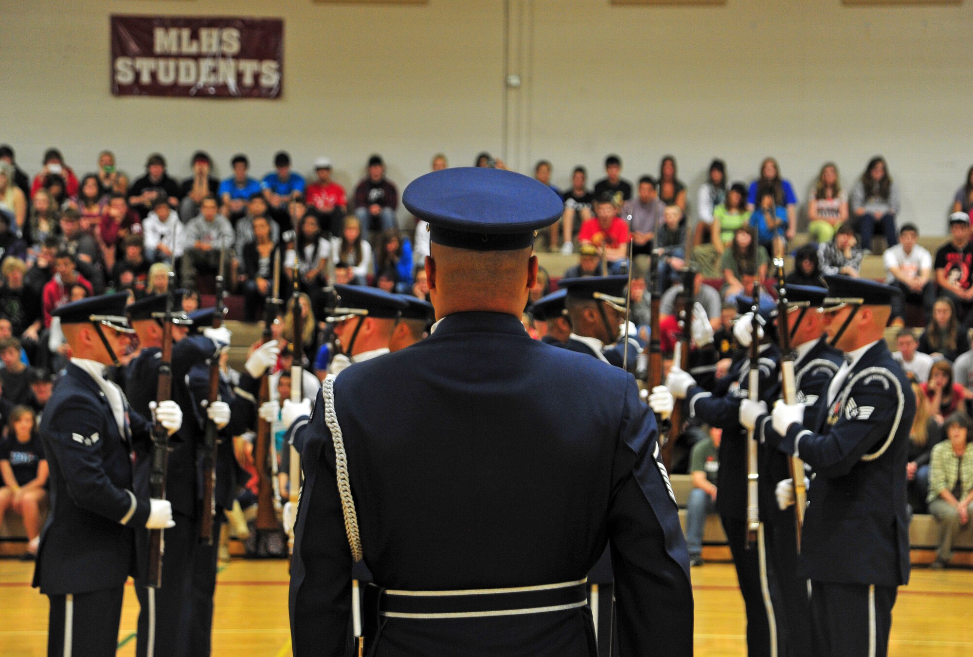 Master Sgt. Whitfield Jack, U.S. Air Force Honor Guard NCO in-charge, leads his drill team during a performance at the Medical Lake High School, Wash., Sept. 19, 2012. The vision of the USAF Honor Guard is to ensure a legacy of Airmen who, promote the mission, protect the standards, perfect the image and preserve the heritage. (U.S. Air Force photo by Airman 1st Class Taylor Curry)