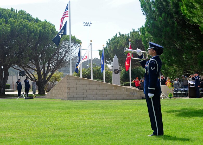 VANDENBERG AIR FORCE BASE, Calif. -- A Team V honor guard member provides military honors during the POW/MIA Recognition Day Ceremony held here Friday, Sept. 21, 2012. This annual ceremony held at Vandenberg's POW/MIA monument is dedicated to honoring our American prisoners of war and missing in action. (U.S. Air Force photo/Michael Peterson)