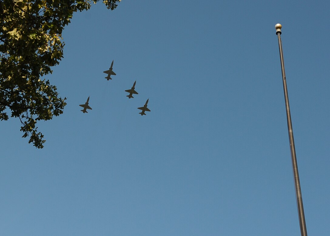 The 49th Fighter Training Squadron executes the Missing Man formation over the Prisoner of War and Missing in Action Day retreat ceremony.  The Missing Man formation is an aerial salute saved for solemn and commemorative events.  (U.S. Air Force Photo/Airman 1st Class Charles Dickens)