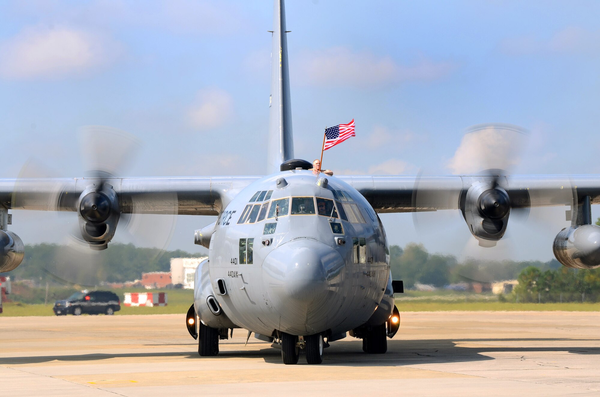 An incoming C-130H taxis Airmen in to a Homecoming ceremony at Dobbins Air Reserve Base on Sept. 21. Over 100 Reservists are scheduled to return to Dobbins ARB from the Middle East beginning today and concluding Monday. (U.S. Air Force photo/Brad Fallin)