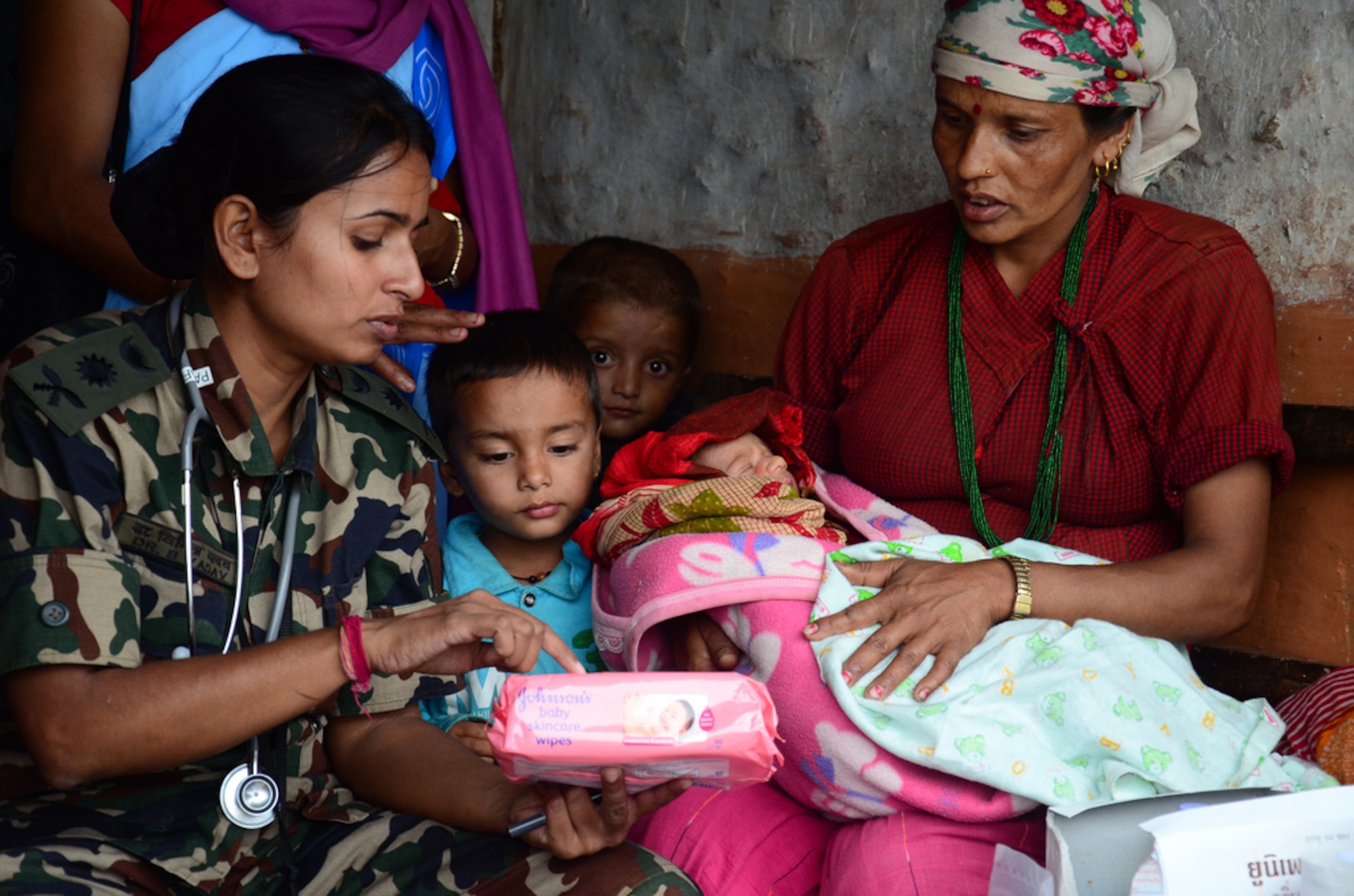 A Nepali woman listens to infant care advice from a Nepalese Army Doctor two
days after her baby was delivered and resuscitated by team Project HOPE and
Nepali health care professionals who were supporting Operation Pacific Angel
12-4 at Nau Danda Health Post of Dhikur Pokhari Village Development
Committee (VDC) of Kaski District, Nepal on Sept. 14, 2012. U.S. Pacific
Command's Operation Pacific Angel 12-4 in Nepal is a Pacific Air Forces
planned event that enhances humanitarian assistance and disaster relief
capabilities between the United States and Pacific partners. The U.S. was
invited by the Nepal government to provide support by conducting medical,
optometry, and civil engineering programs. Operations like Pacific Angel
build and sustain relationships with our multinational partners, and
non-governmental agencies in the Asia-Pacific region. (Courtesy photo)
