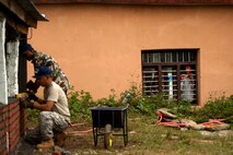Nepali children look through a window at Machhapuchhre Higher Secondary
School of Dhikur Pokhari, Nepal and watch U.S. Air Force and Nepalese Army
civil engineers repair one of the school's buildings during Operation
Pacific Angel 12-4 on Sept. 9, 2012. U.S. Pacific Command's Operation Pacific
Angel 12-4 in Nepal is a Pacific Air Forces planned event that enhances
humanitarian assistance and disaster relief capabilities between the United
States and Pacific partners. Operations like Pacific Angel build and sustain
relationships with our multinational partners in the Asia-Pacific region. (U.S. Air Force photo/Master Sgt. Jeffrey Allen)

