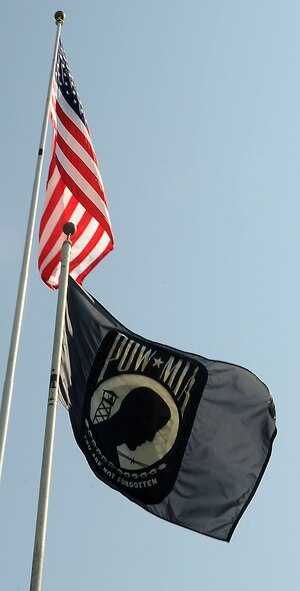 A Prisoner of War/Missing in Action flag is flown on Barksdale Air Force Base, La., Sept. 21. The third Friday of September is recognized as National POW/MIA Recognition Day. It honors those who were prisoners of war and those who are still missing in action. It?s one of six days that the POW/MIA flag can be flown. On Aug. 10, 1990, the 101st Congress passed U.S. Public Law 101-355, which recognized the POW/MIA flag and designated it as the symbol of our Nation?s concern and commitment to resolving as fully as possible the fates of Americans who are still prisoners, missing and unaccounted for in Southeast Asia, thus ending the uncertainty for their families and the Nation. Beyond Southeast Asia, it has been a symbol for POW/MIAs from all American wars to date. (U.S. Air Force photo/Senior Airman Kristin High)(RELEASED)