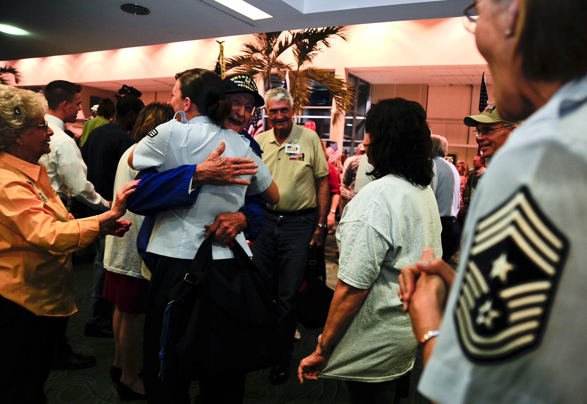 Senior Airman Jessica Kinser, a 6th Medical Support Squadron medical laboratory technician, hugs World War II veteran Bill Short upon his arrival home from the seventh Honor Flight of West Central Florida Sept. 18, 2012, at the St Petersburg Clearwater International Airport, Fla. A total of 77 WWII veterans were a part of the seventh Honor Flight, they were flown to Washington D.C. to tour the WWII memorial.(U.S. Air Force photo by Staff Sgt. Angela Ruiz)